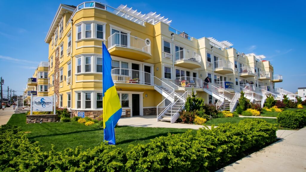 Luxury beachfront condominium development with balconies and landscaped grounds