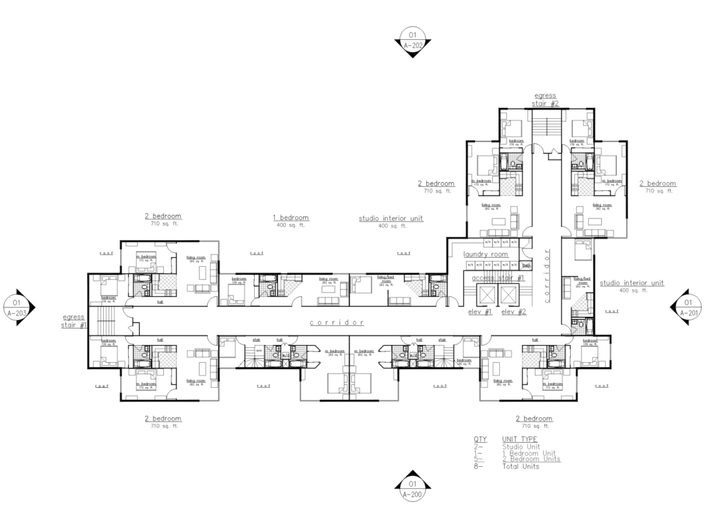 Architectural residential floor plan showing studio, one-bedroom, and two-bedroom apartments arranged around a central corridor with elevators, laundry room, and stair access.