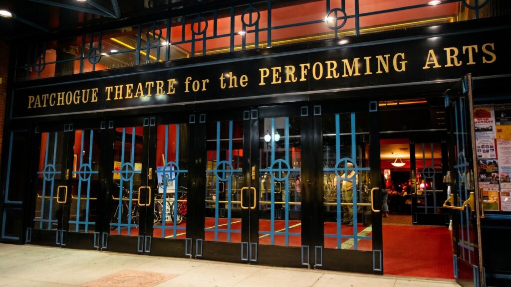 Entrance of Patchogue Theatre for the Performing Arts illuminated at night