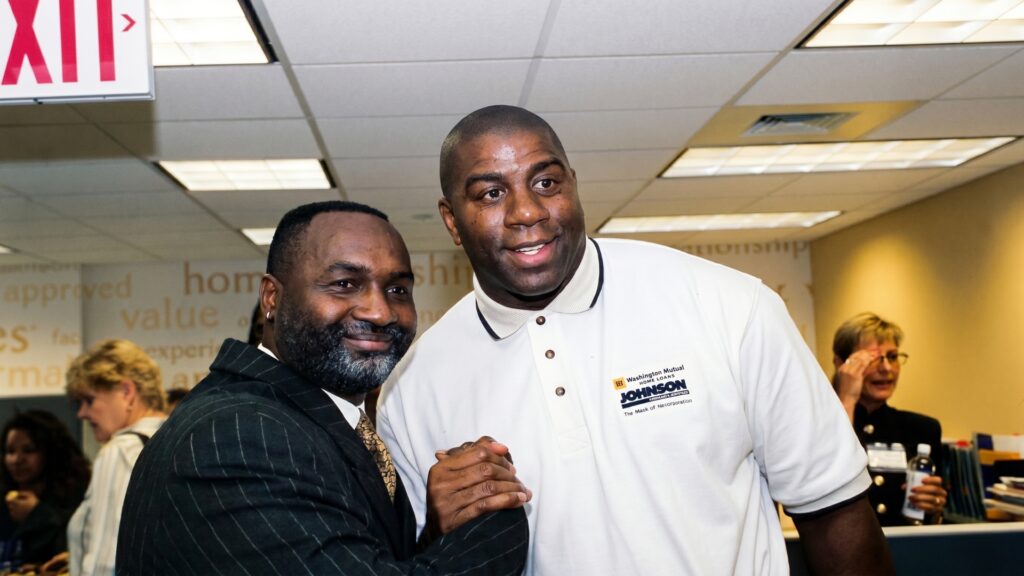Eric Owes and Magic Johnson at a Washington Mutual Home Loans event